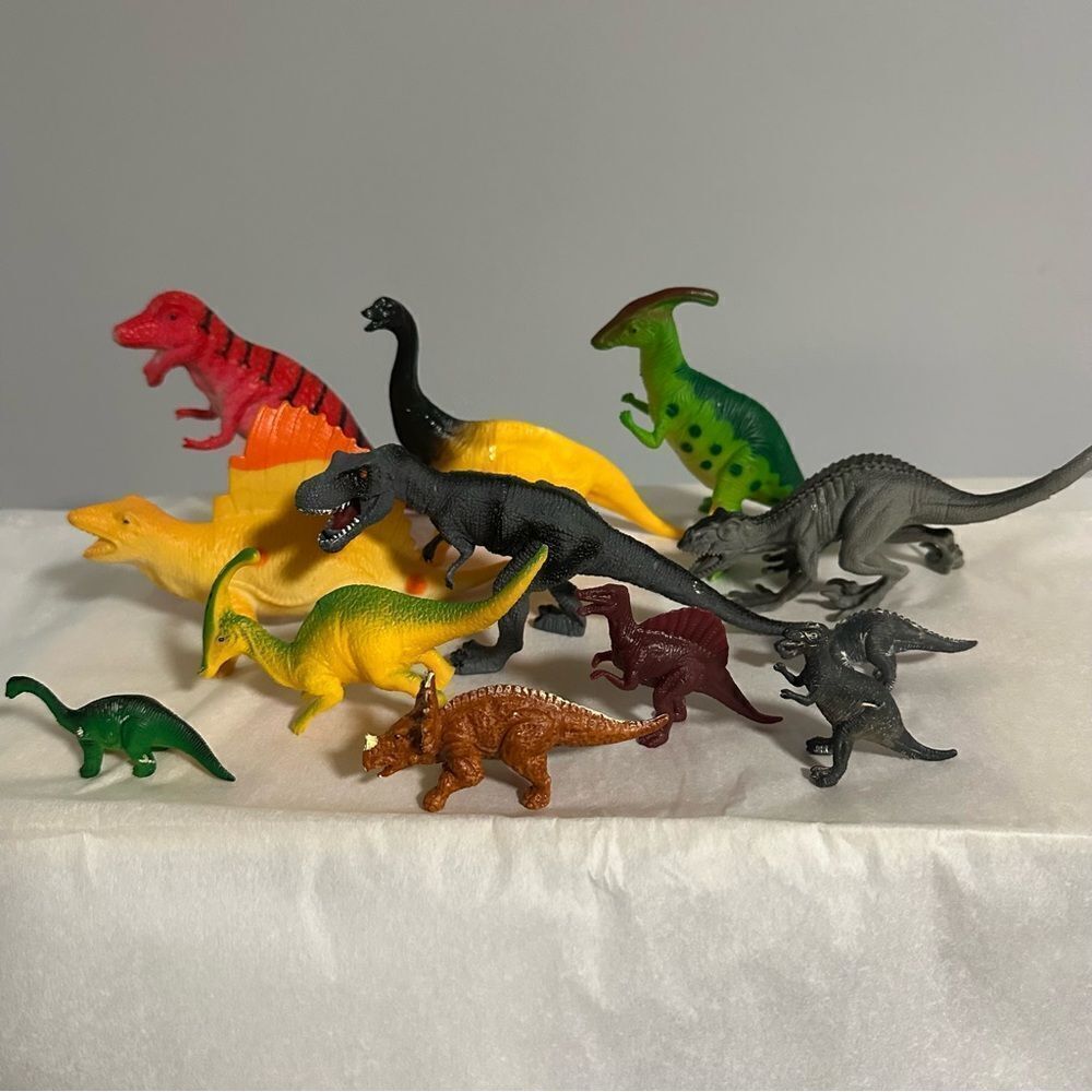 Lot of 12 assorted sizes hard plastic dinosaurs